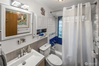 The main floor bathroom has fun tile accents in bath and shower area- make sure to check them out.