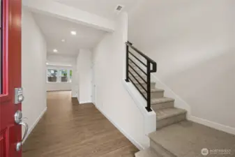 Wide entry with open, metal railing. Photo is representational. Actual home is under construction and materials, colors, and finishes will vary. See site agent for details.