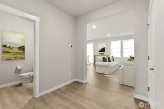 Main level powder room.  Photo is representational. Actual home is under construction and materials, colors, and finishes will vary. See site agent for details.