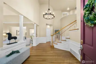 Grand, light-filled foyer with soaring ceilings and refined architectural presence