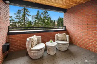 Covered balcony with views of downtown Bellevue