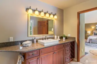 Dual vanities with elegant stone finishes.