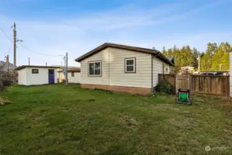 Nice back yard space with two storage sheds - one is attached to the carport.