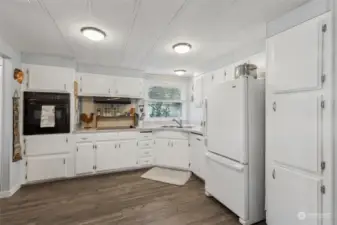 Light and bright kitchen with plenty of cabinetry.