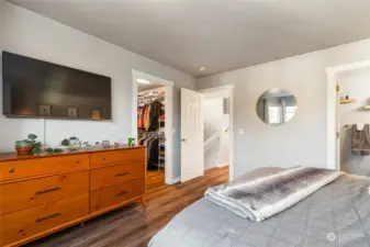 Another angle of primary bedroom. Peeking into HUGE walk in closet and bathroom.