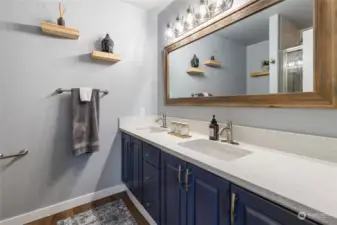 Primary bathroom with new quartz countertop to match the kitchen.