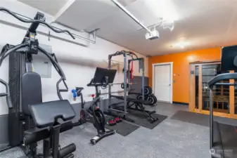 Deep 1-car garage currently being used as a home gym. Sauna does not transfer but may be negotiated separately.