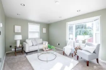 The family room is a fantastic addition to the home. It has so much light and a lovely bay window.