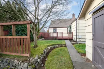 This yard has some nice landscaping, and it is a well-loved home!