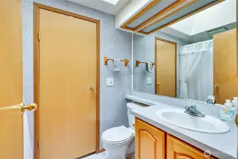 Full bath in hallway, Laundry room thru the door.