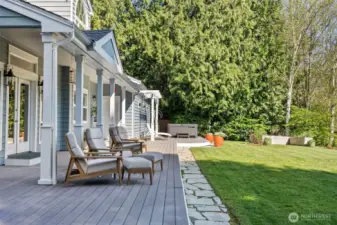 Composite deck overlooks the back yard, hot tub included