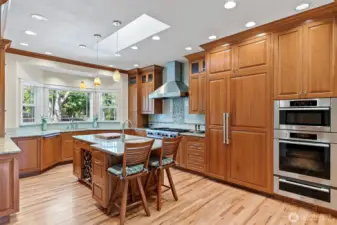Updated gourmet kitchen with custom cabinetry and paneled appliances