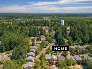 Home is nestled in the tree-lined community of Whisper Ridge