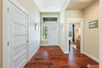 Entryway, coat closet and door to office facing East