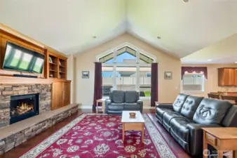 Spacious living room with bright light to fenced level yard. RV Parking, 3 car garage