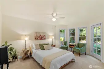 Wake-up in you light filled main-floor primary bedroom with outdoor deck access and ensuite.