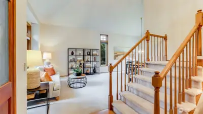 As you look to your left the spacious living room shows the soaring vaulted ceiling plus large bay window.