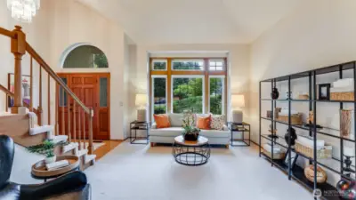 Looking from the dining room into the living room.  As you look through the windows all you see is privacy-no other houses.