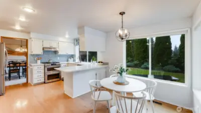 The entire back of the home has views and fantastic privacy. Steps from the kitchen there is a perfect eating nook that is great for casual meals, homework and relaxation.