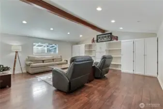 Family room view 1, just a massive space with vaulted ceilings, gorgeous flooring and tremendous built-ins. Love the giant beam as well!