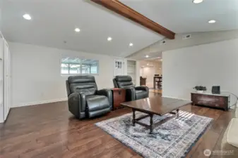 Family room view 2 toward dining room, door leads to your covered deck you can see through windows.