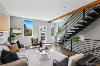 Heading upstairs from the main living…