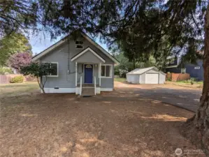 Cozy house with detached garage next to it. Plenty of yard space to enjoy!