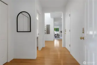 As you enter there is a large entry way closet on your left, a half bath, and the entrance to the garage on the right.