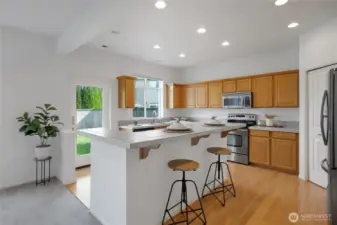 The kitchen has a large island with Breakfast Seating.