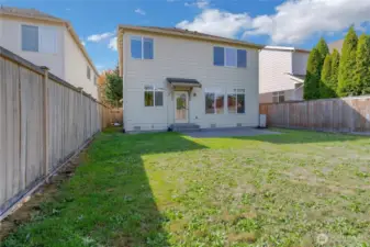 Fully fenced deep back yard with patio.