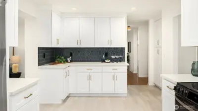 The coffee pot, toaster, and the pots and pans all have a place in this kitchen.