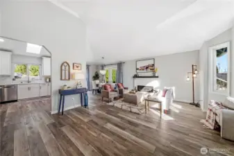 Open & airy main living room w/ bay window.
