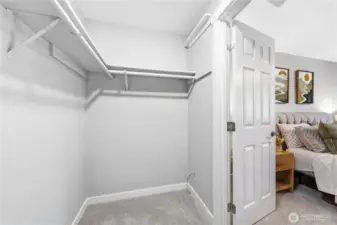 Walk-in closet in primary bedroom.