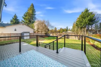 Large 2-tier deck w/ custom railing and composite decking for maintenance free enjoyment.