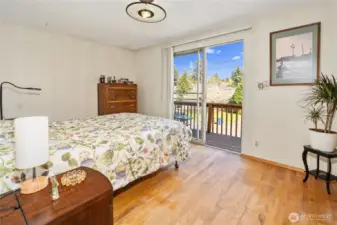 Primary bedroom has private east-facing deck.