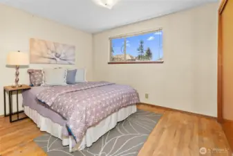 Bedroom #2, on upper level with window over backyard.