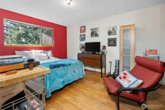 Bedroom #3 on upper level, overlooking backyard.