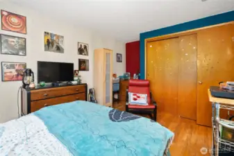 Built-in drawers alongside closet.