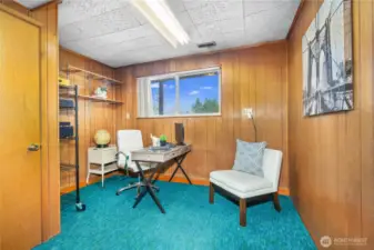 Wood paneled office with good-sized closet.