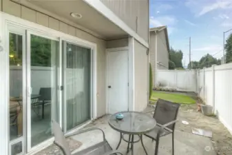 Private patio with storage closet.