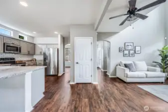 The open-concept design seamlessly connects the kitchen, living room, and breakfast nook, creating a bright and spacious flow that’s perfect for everyday living and entertaining.