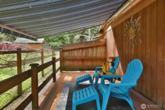 Deck with automatic Sunbrella awning off the living room.