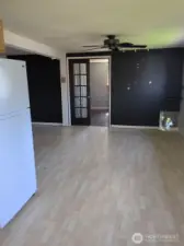 Main living area, double doors lead into bedroom