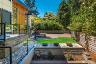 A beautifully designed water feature at the front entry adds a touch of serenity and sophistication, creating a striking first impression.