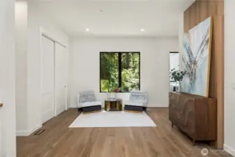 An inviting entry sitting area blends comfort with design, creating a graceful transition into the heart of the home.