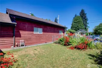 Fully fenced yard with ample space for pets, gardening, or play