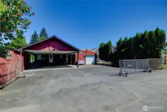 Alley access to gated driveway, garage, and carport - perfect for extra parking or work vehicles