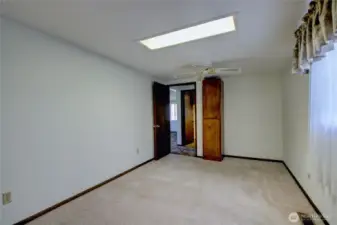 Bright primary bedroom with nearby bath