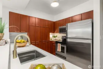 new quartz counters, new sink, new faucet, new lights, new hardware on cabinets