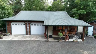 Awesome shop with log accents and metal roof. You have to see inside!
